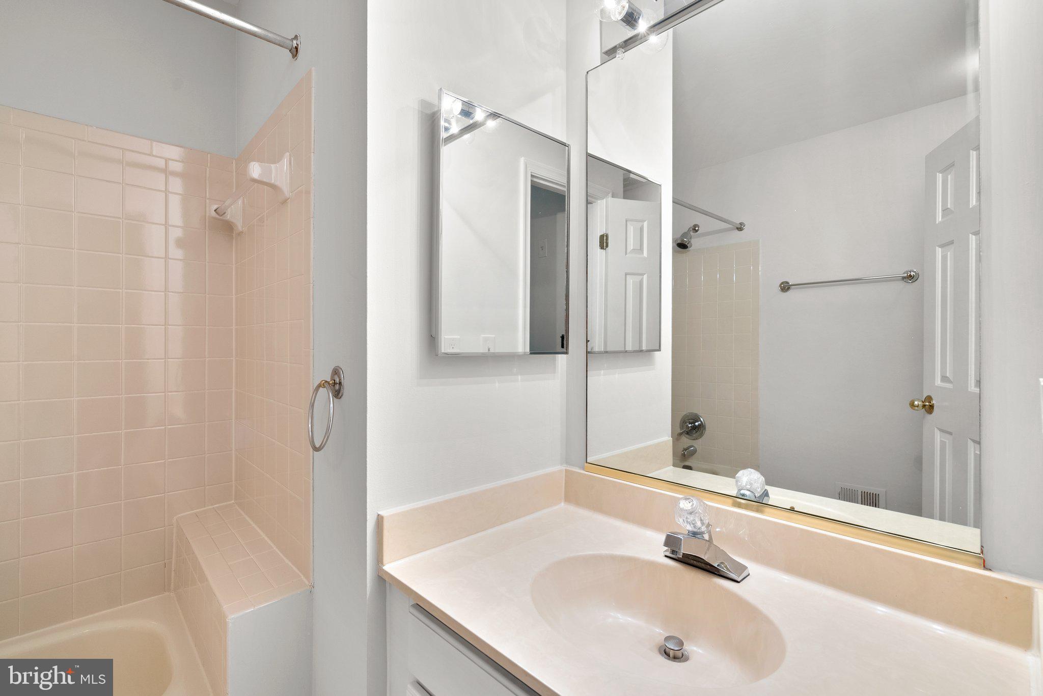 14620 Jaystone Drive Silver Spring, MD 20905 - Photo 29 of 52 a bathroom with a sink and a mirror