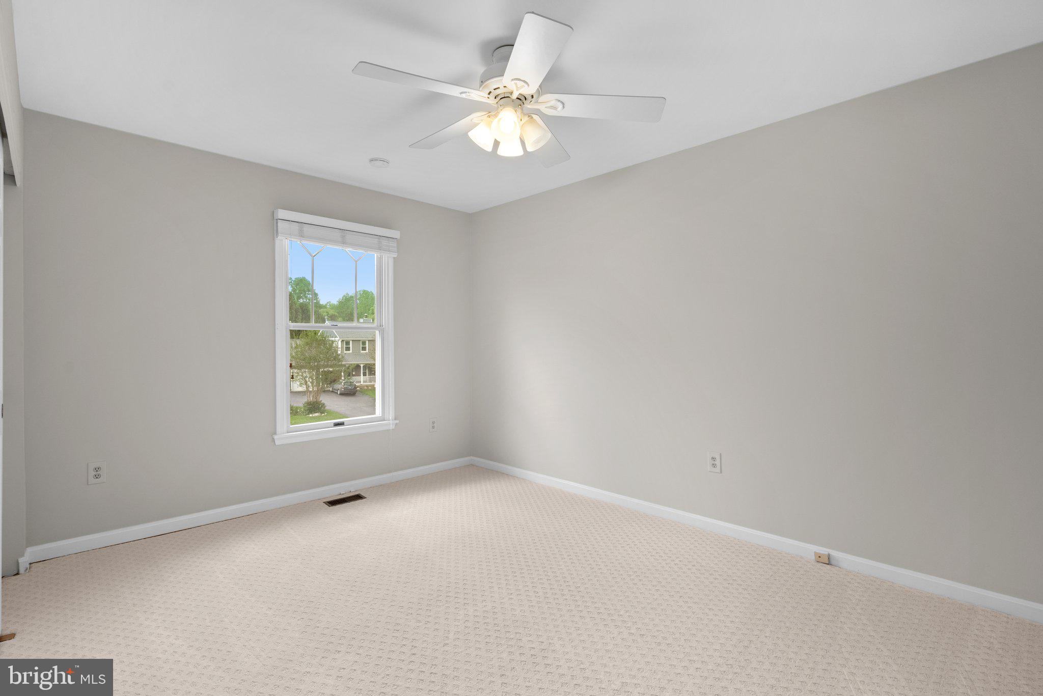 14620 Jaystone Drive Silver Spring, MD 20905 - Photo 31 of 52 an empty room with a window and a fan