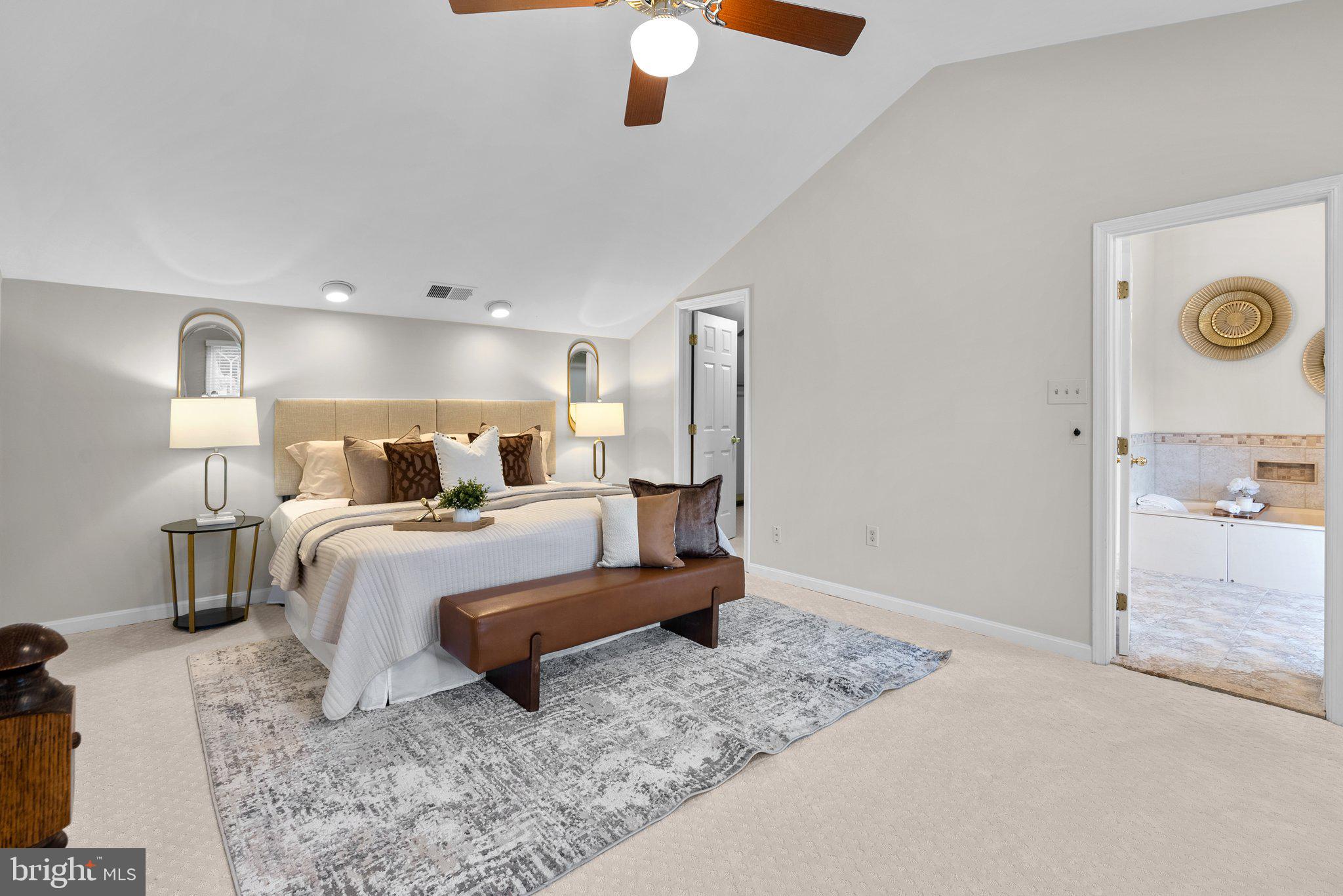 14620 Jaystone Drive Silver Spring, MD 20905 - Photo 34 of 52 a bedroom with a bed and a chandelier