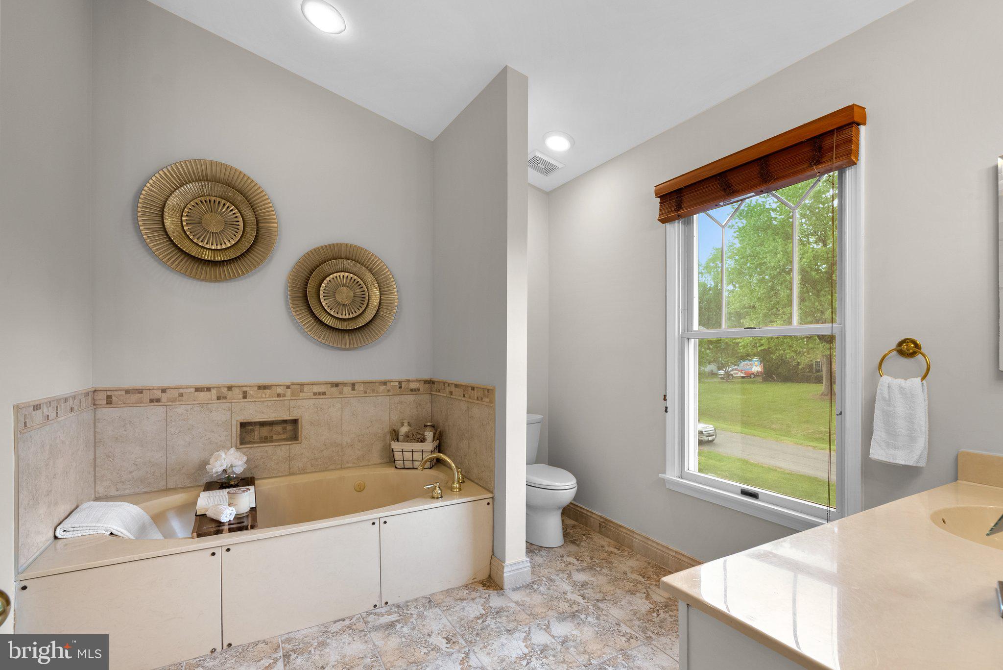 14620 Jaystone Drive Silver Spring, MD 20905 - Photo 39 of 52 a bathroom with a tub and a window