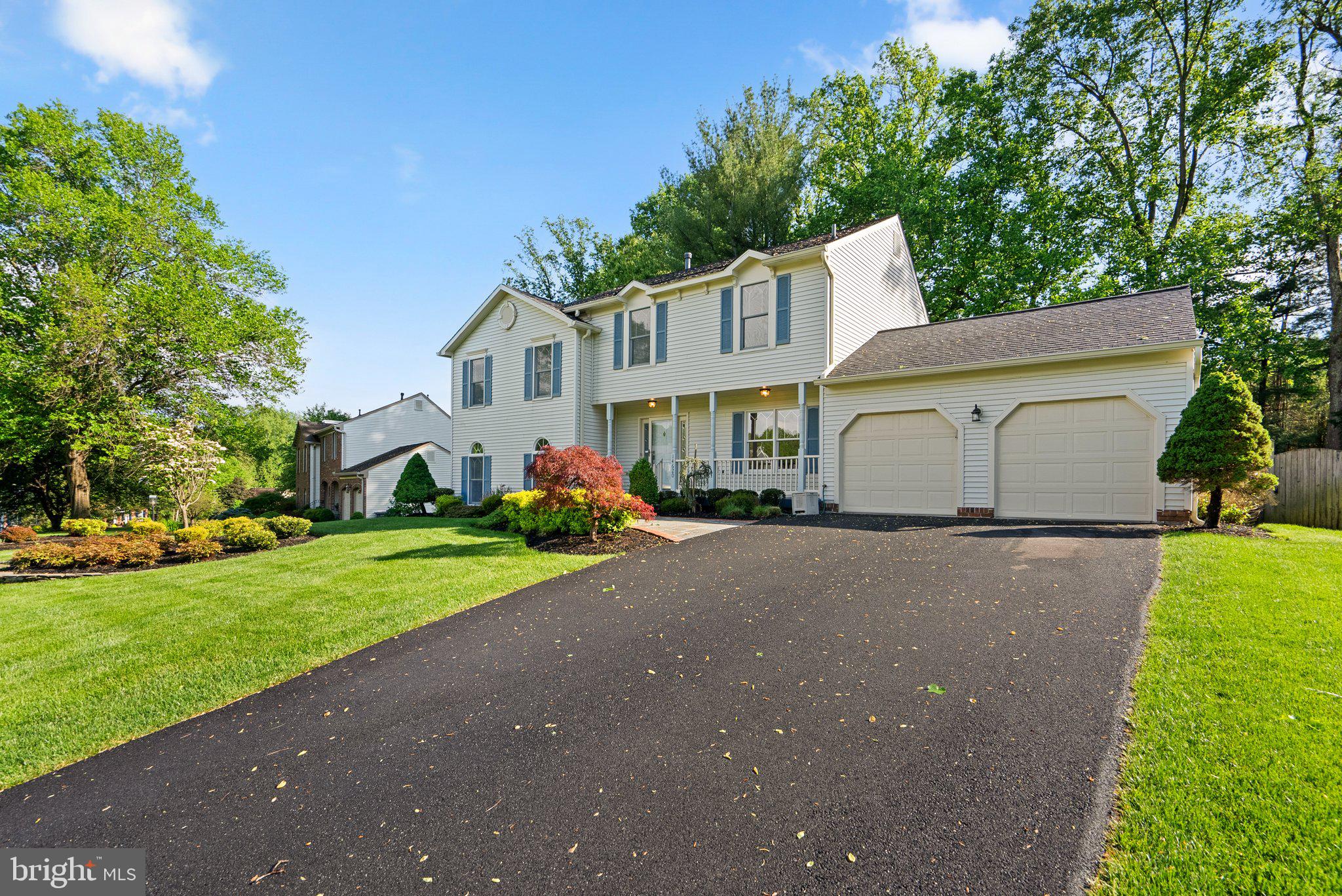 14620 Jaystone Drive Silver Spring, MD 20905 - Photo 4 of 52 a front view of a house with a yard and garage