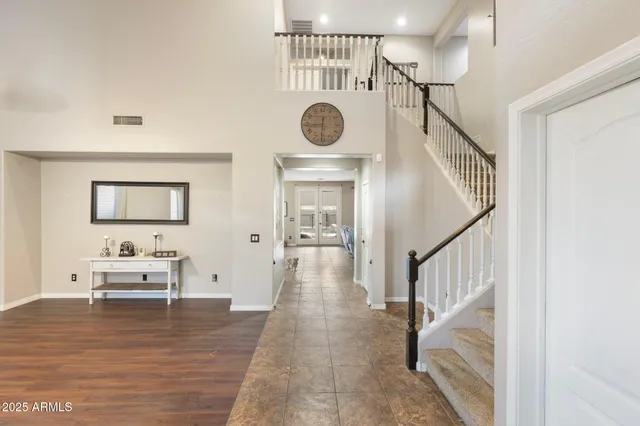 a view of entryway livingroom and hall with wooden floor