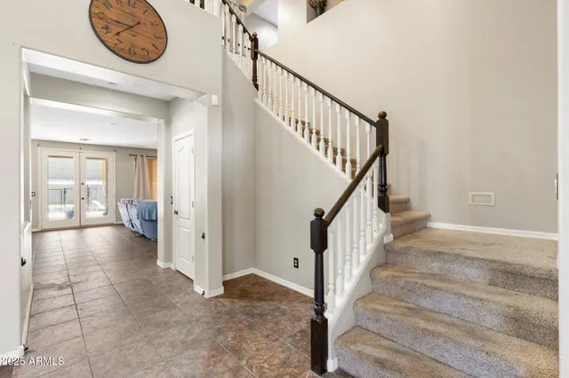 a view of entryway and hall with a door
