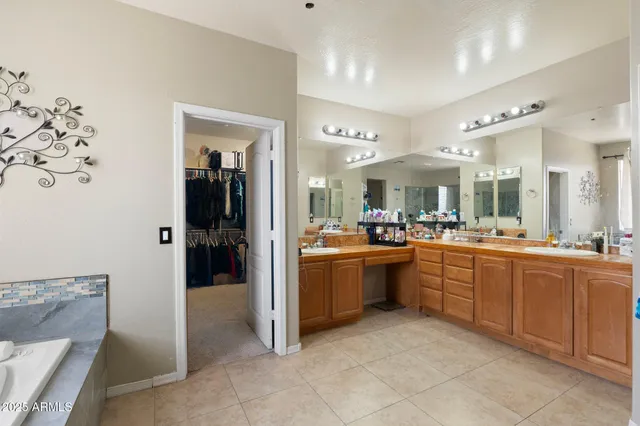 a large kitchen with a lot of counter space and a refrigerator