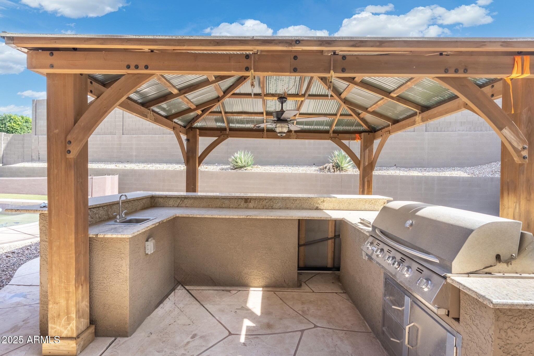 6202 West Maya Drive Phoenix, AZ 85083 - Photo 39 of 43 a kitchen with a sink a counter top space and stainless steel appliances
