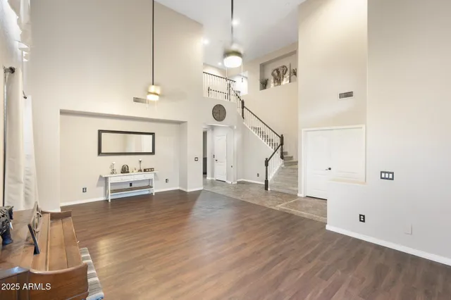 a view of an entryway with wooden floor