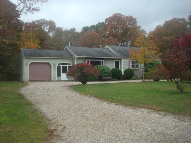 262 Jones Road Marstons Mills, MA 02648 - Photo 1 of 8 a front view of a house with garden