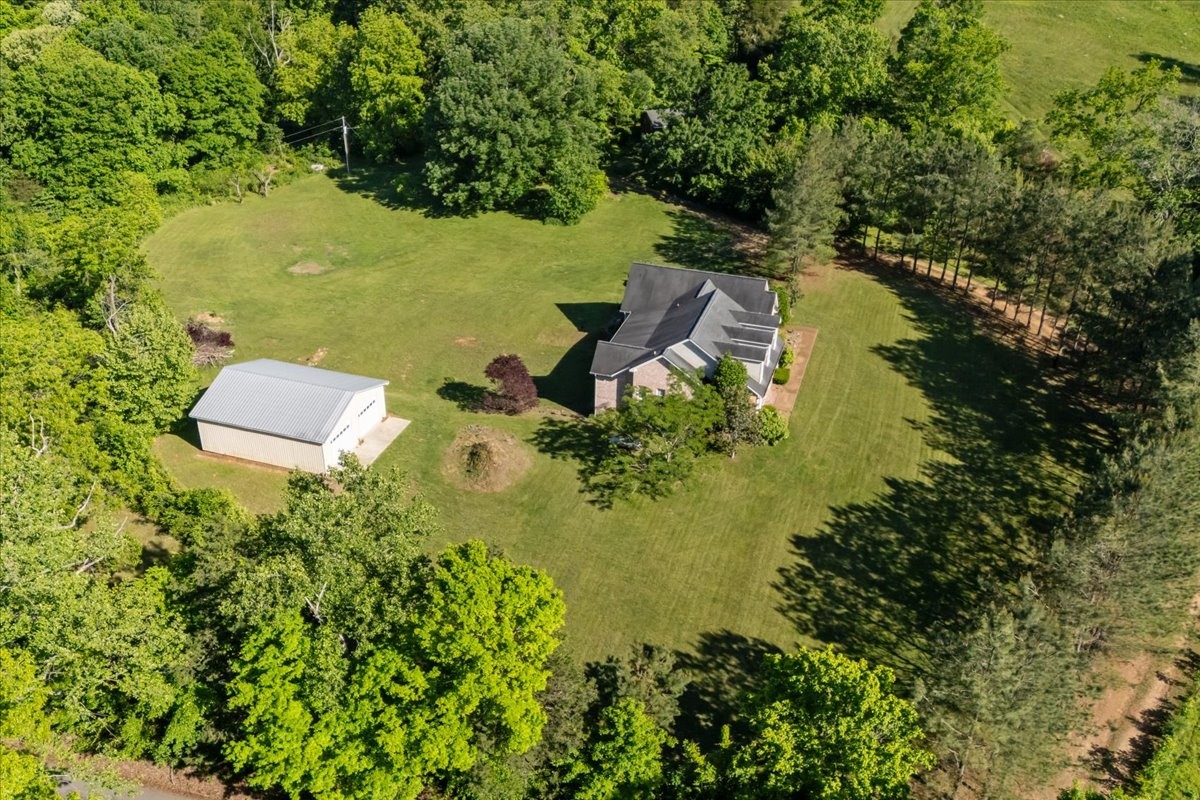2440 Maple Grove Road Dickson, TN 37055 - Photo 71 of 99 an aerial view of residential house with outdoor space and trees all around