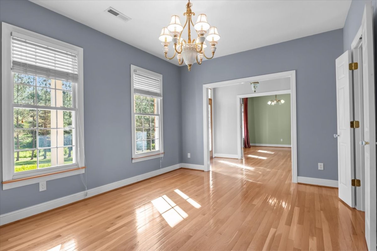 2440 Maple Grove Road Dickson, TN 37055 - Photo 10 of 99 a view of empty room with wooden floor and fan