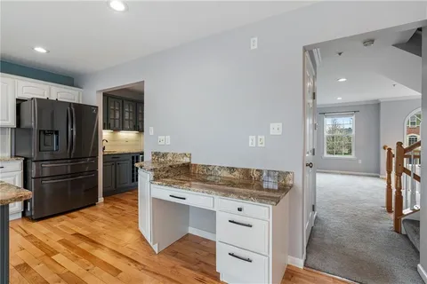 a kitchen with a refrigerator and countertop