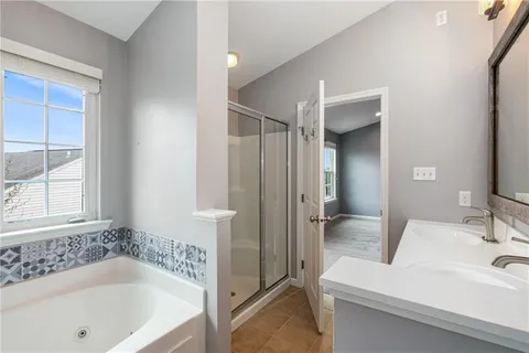 a bathroom with a bathtub and a sink