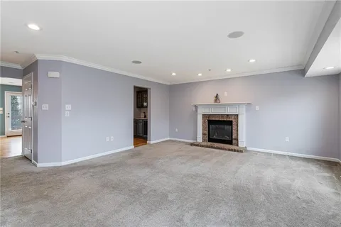 an empty room with an empty space and a fireplace