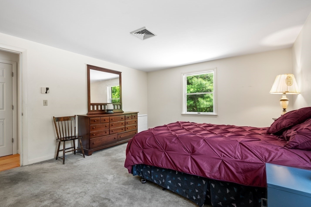 7 Bray Street Gloucester, MA 01930 - Photo 14 of 26 a bedroom with a bed and a window