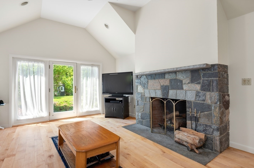 7 Bray Street Gloucester, MA 01930 - Photo 4 of 26 a living room with furniture and a flat screen tv