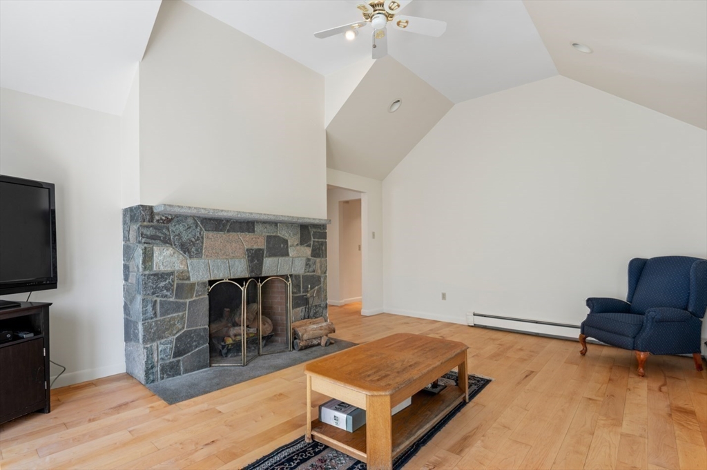 7 Bray Street Gloucester, MA 01930 - Photo 9 of 26 a living room with furniture and a flat screen tv