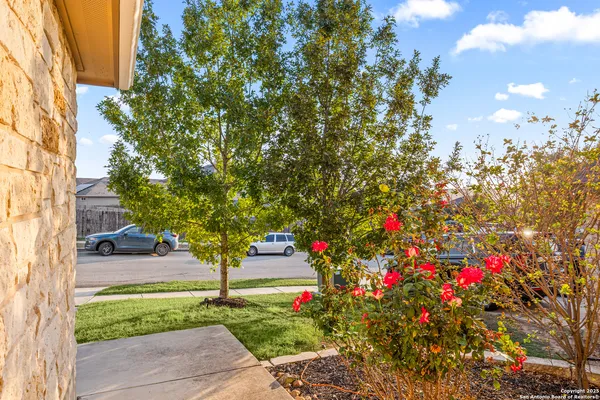 a kitchen with stainless steel appliances granite countertop a sink a stove a microwave and a refrigerator