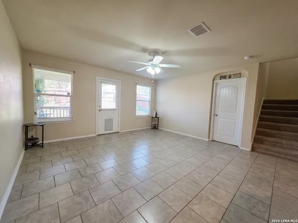 a view of a living room and kitchen with furniture