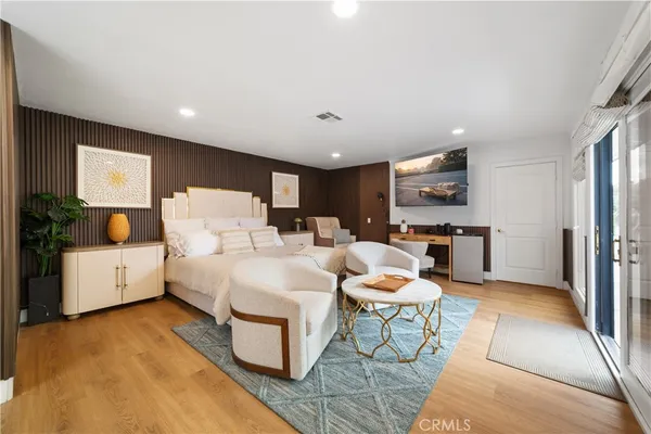 a bedroom with a bed and a table in it