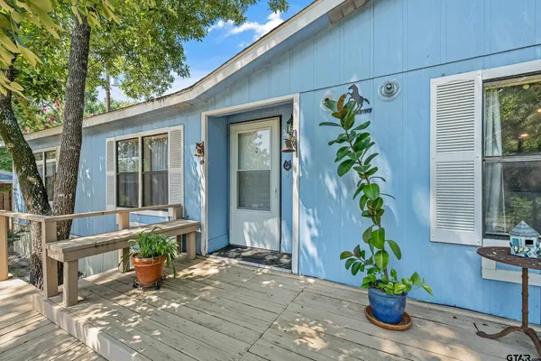 a view of a entryway door of the house with chairs
