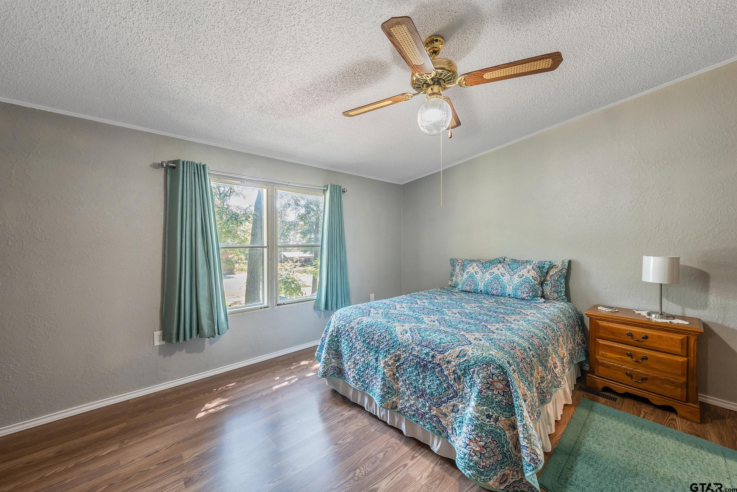 110 Sycamore Lane Murchison, TX 75778 - Photo 18 of 47 a bedroom with a bed and a window