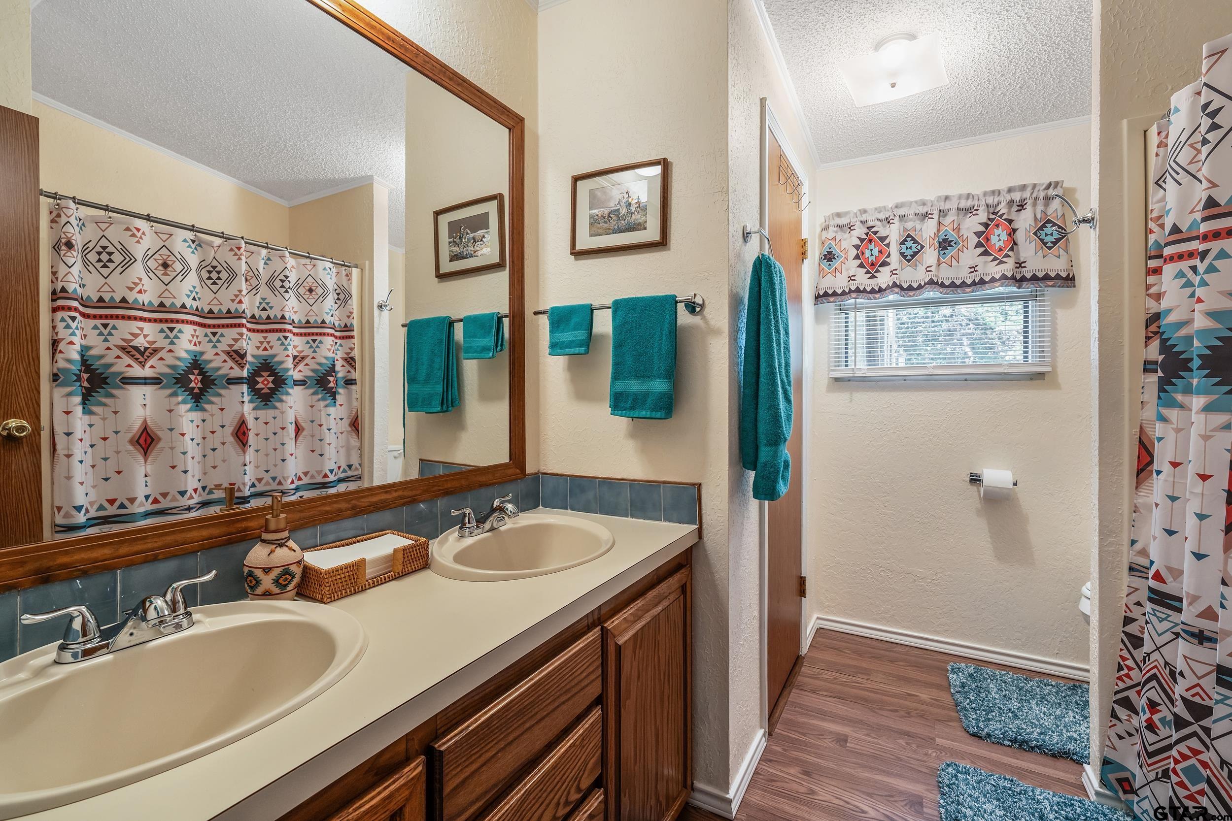 110 Sycamore Lane Murchison, TX 75778 - Photo 21 of 47 a bathroom with a sink and a mirror