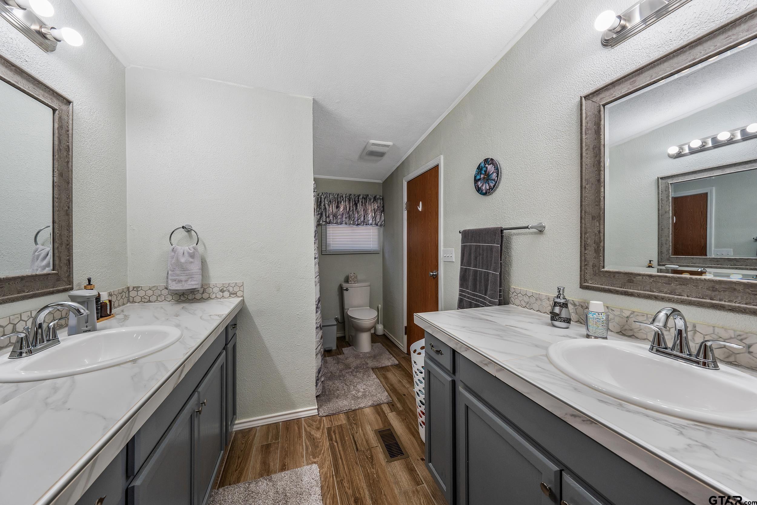 110 Sycamore Lane Murchison, TX 75778 - Photo 22 of 47 a bathroom with a sink and a mirror
