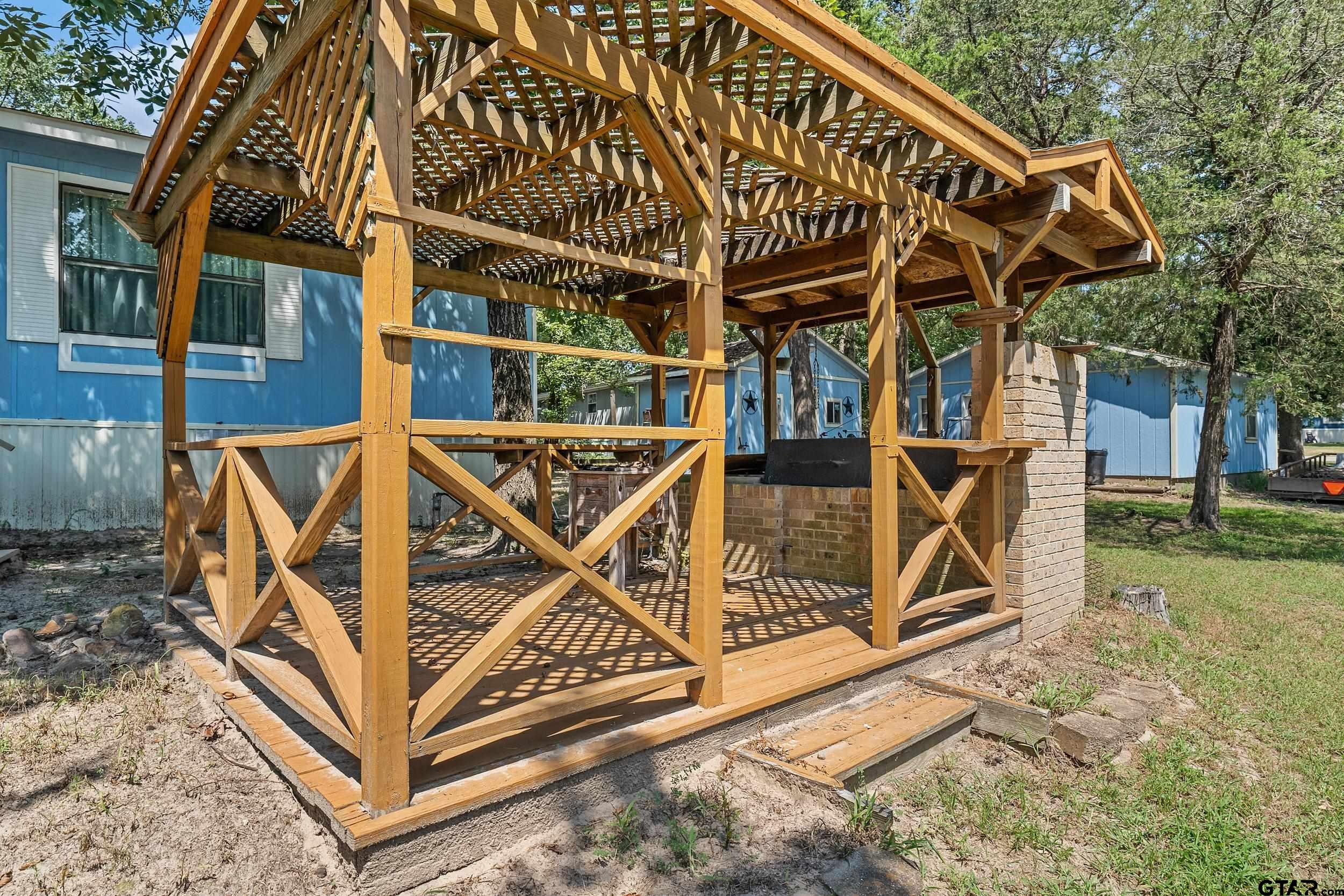 110 Sycamore Lane Murchison, TX 75778 - Photo 26 of 47 a view of a chairs with wooden fence