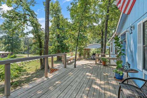 a kitchen with stainless steel appliances granite countertop a refrigerator a stove and a sink with dishwasher