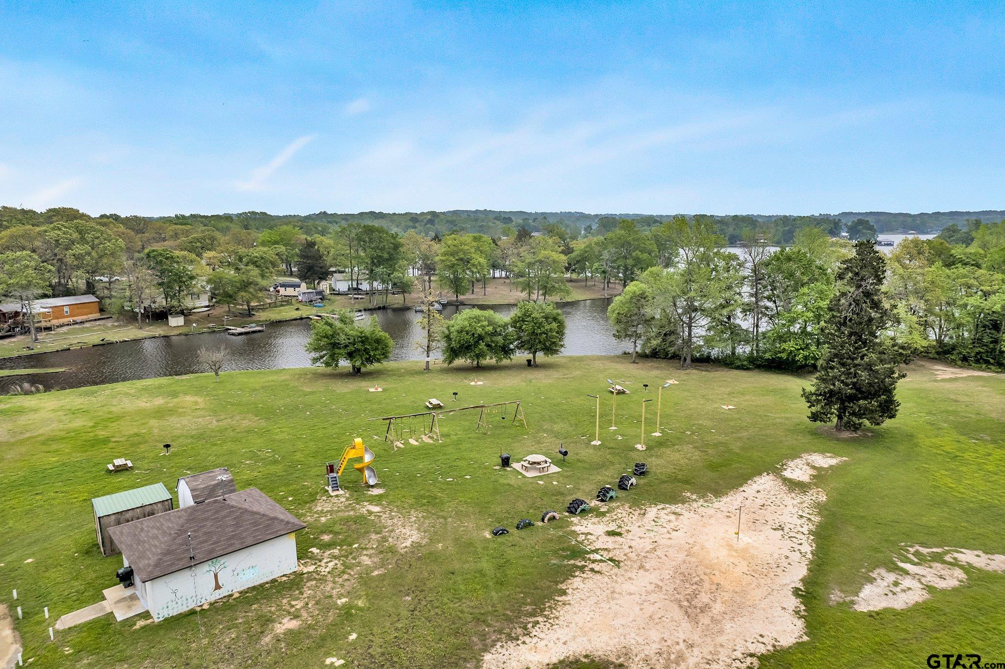 110 Sycamore Lane Murchison, TX 75778 - Photo 35 of 47 a view of a lake with a houses