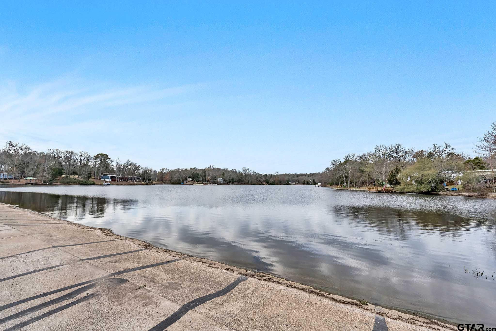 110 Sycamore Lane Murchison, TX 75778 - Photo 39 of 47 a view of a lake with houses in the background