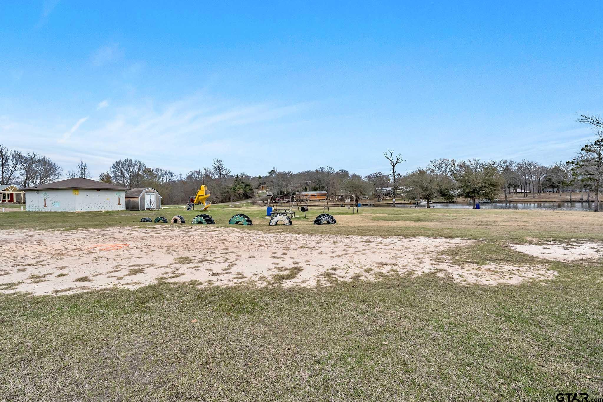 110 Sycamore Lane Murchison, TX 75778 - Photo 40 of 47 a view of a lake with houses in the background