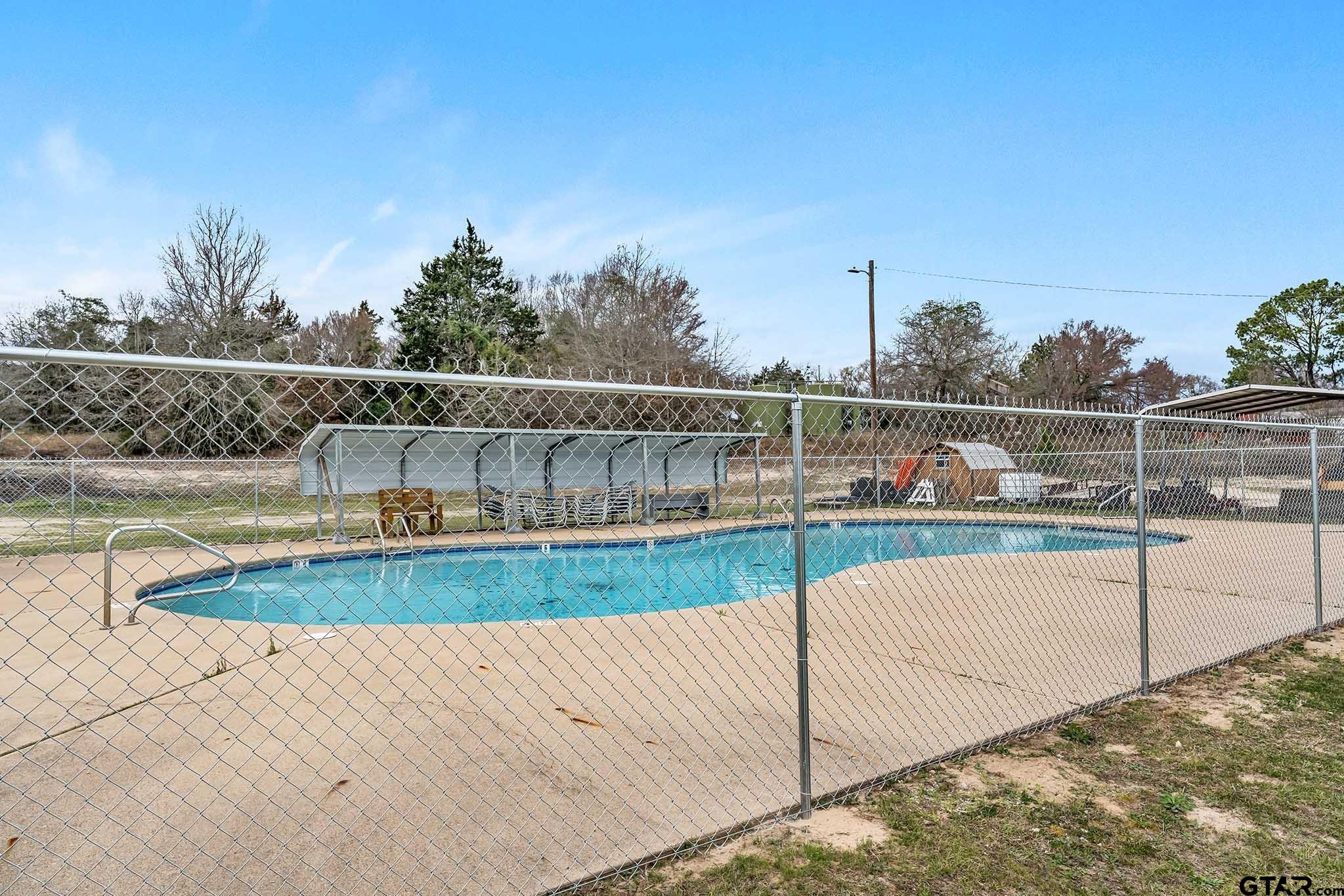 110 Sycamore Lane Murchison, TX 75778 - Photo 44 of 47 a view of a swimming pool with a yard