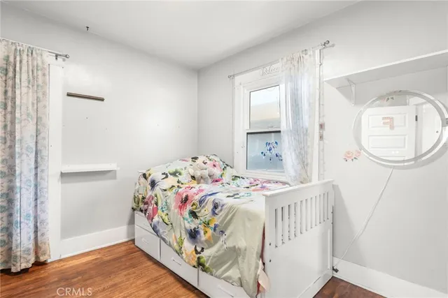 a open kitchen with a sink cabinets and wooden floor