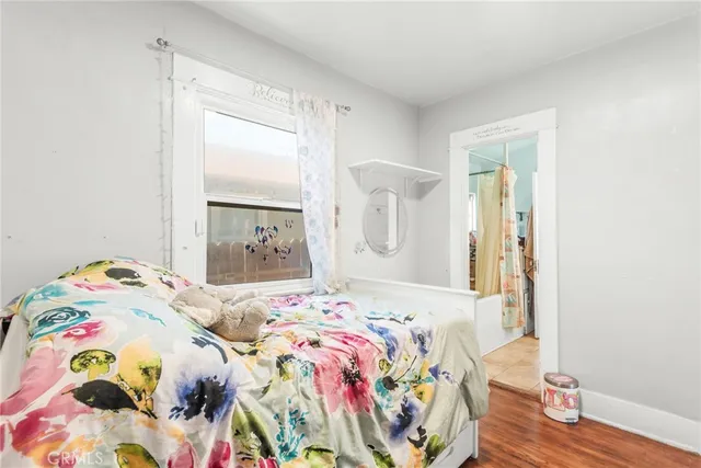 a living room with furniture a refrigerator and a table