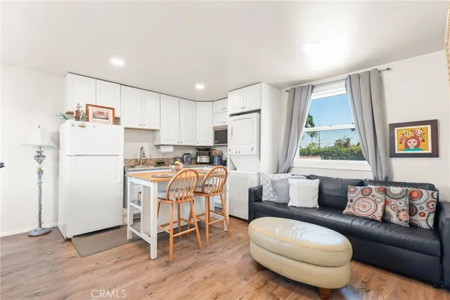 a view of hallway with furniture and a window