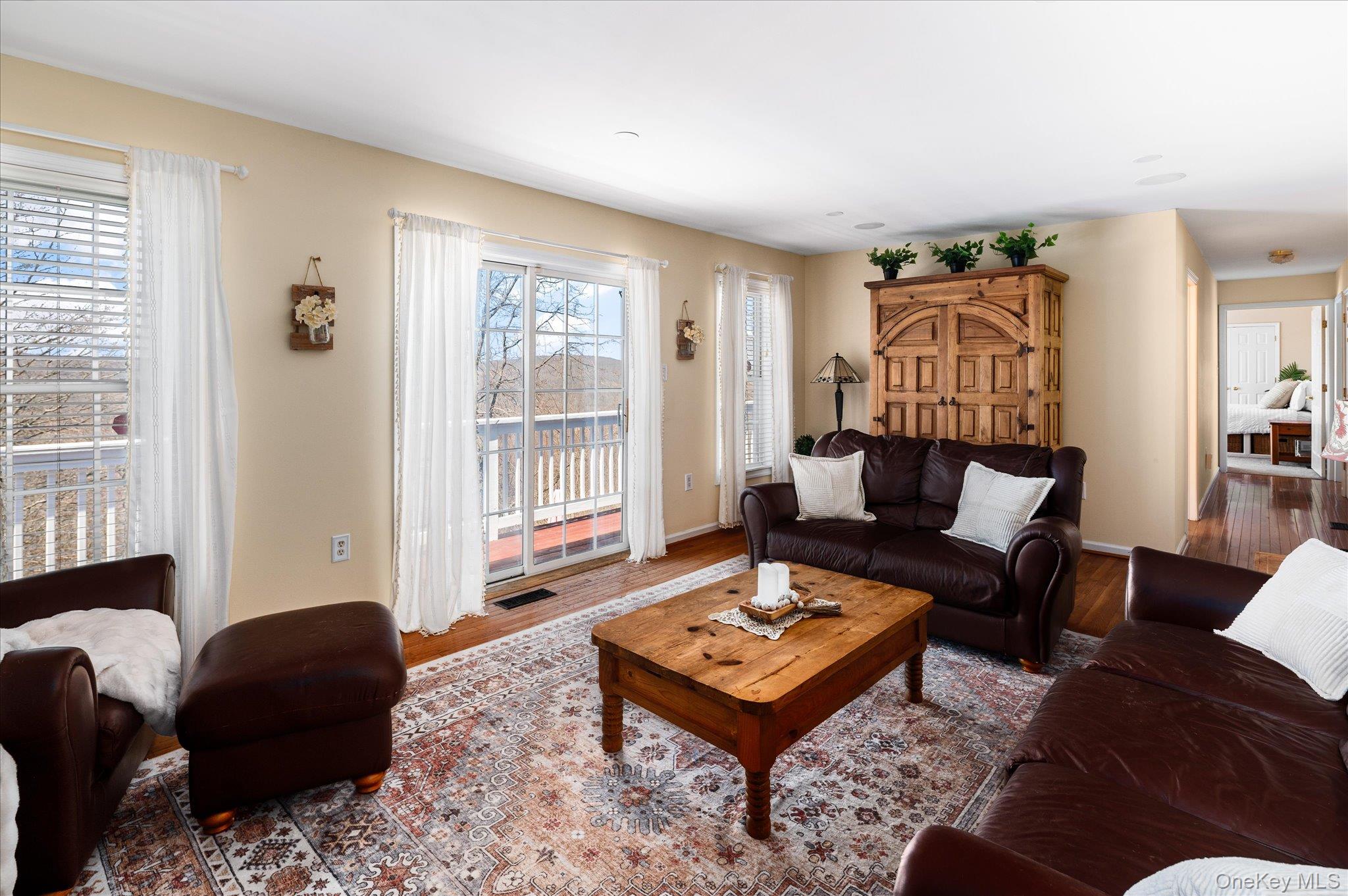 581 Barrett Hill Road Mahopac, NY 10541 - Photo 15 of 37 Sliders to the deck, views from the sofa