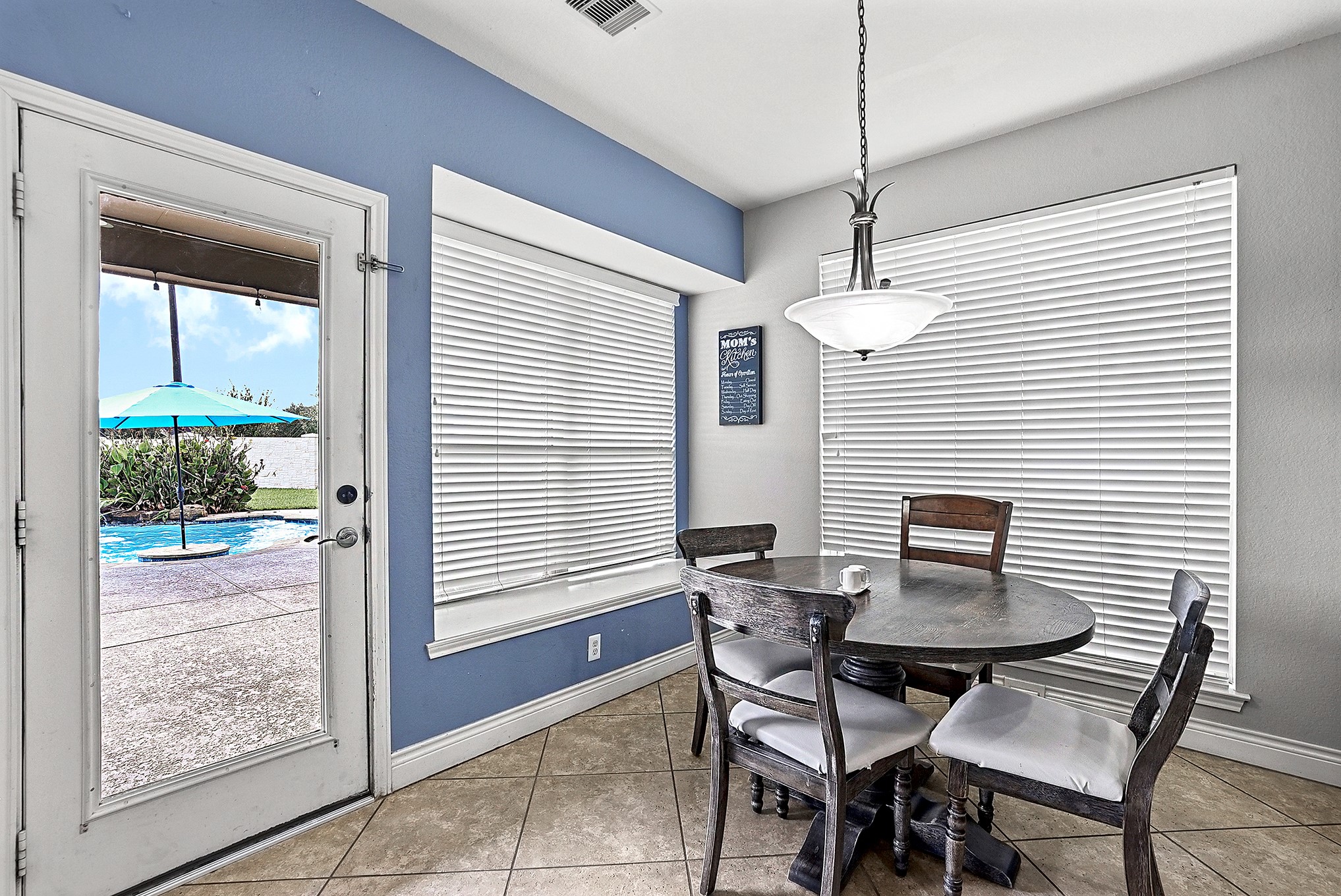 2951 Bobby Jones Road Katy, TX 77494 - Photo 18 of 50 A closer look at the spacious breakfast room, featuring beautiful poolside views and plenty of natural light, creating a bright and inviting space for everyday dining.