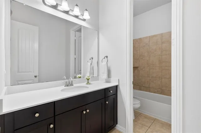 a bathroom with a sink double vanity and a mirror