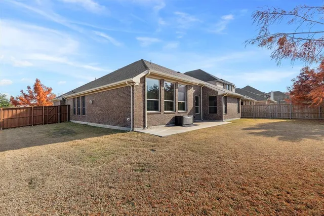 a view of a house with snow on the tree