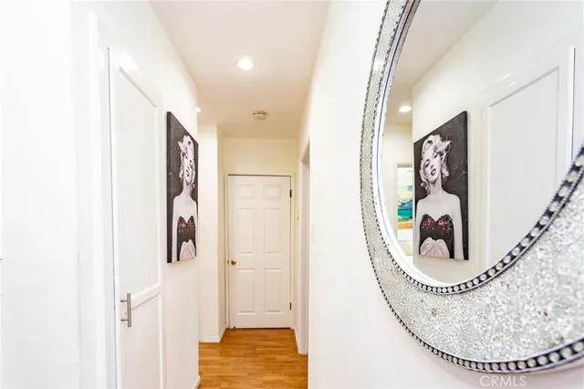 a view of a hallway with windows and entryway