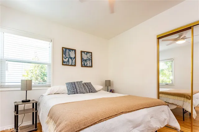 a bedroom with a bed and a window