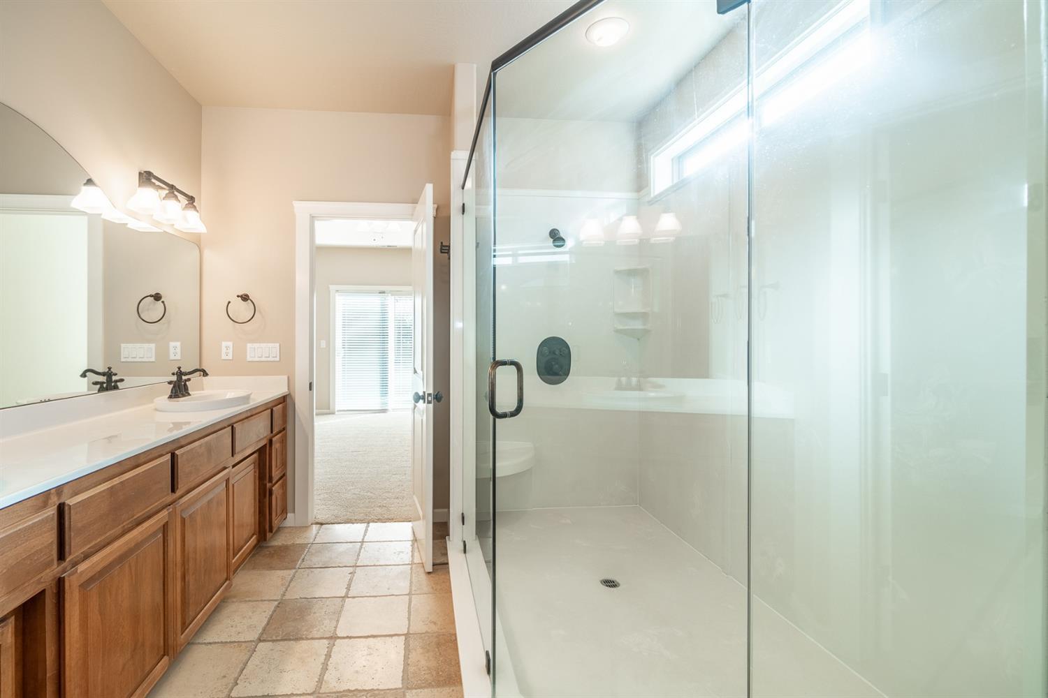 946 Pumpkin Ridge Eagle Point, OR 97524 - Photo 31 of 31 a bathroom with a shower and a sink