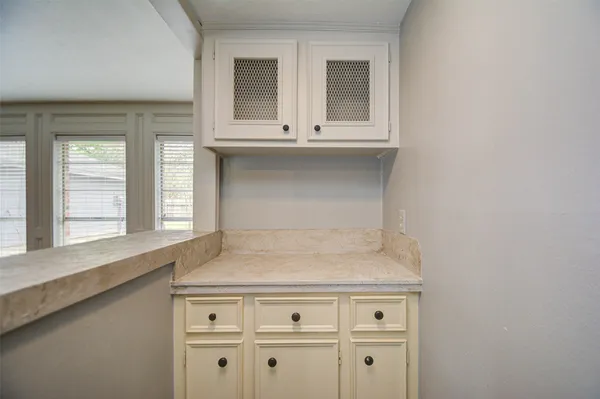 a view of washer and dryer with white walls