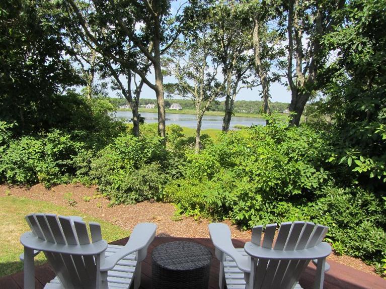 a view of a chairs and table in the patio