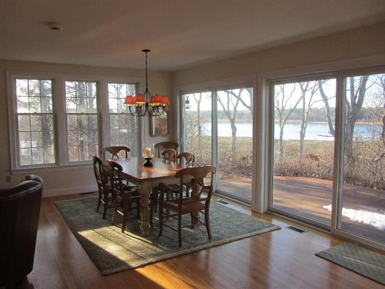 102 Marsh View Road Chatham, MA 02633 - Photo 11 of 23 a view of a dining room with furniture window and outside view