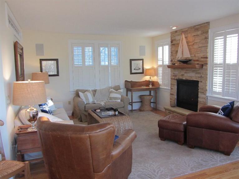 102 Marsh View Road Chatham, MA 02633 - Photo 12 of 23 a living room with furniture and a fireplace
