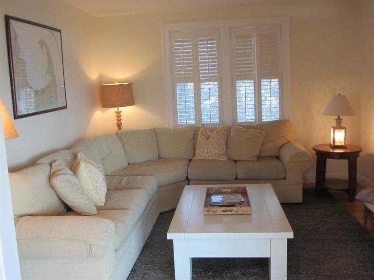 102 Marsh View Road Chatham, MA 02633 - Photo 14 of 23 a living room with furniture and a fireplace