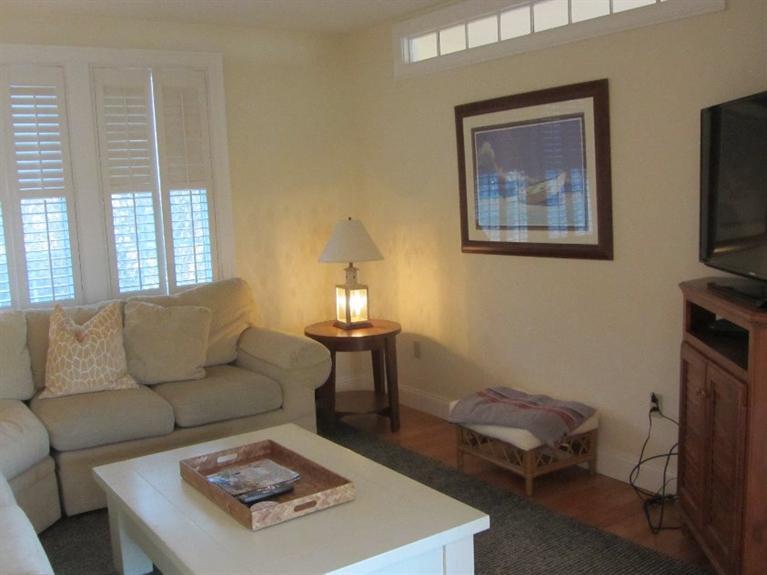 102 Marsh View Road Chatham, MA 02633 - Photo 15 of 23 a living room with furniture a flat screen tv and a fireplace