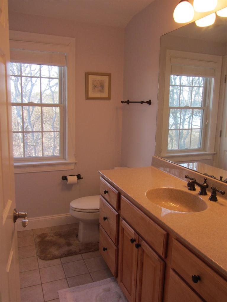 102 Marsh View Road Chatham, MA 02633 - Photo 18 of 23 a bathroom with a sink toilet and window