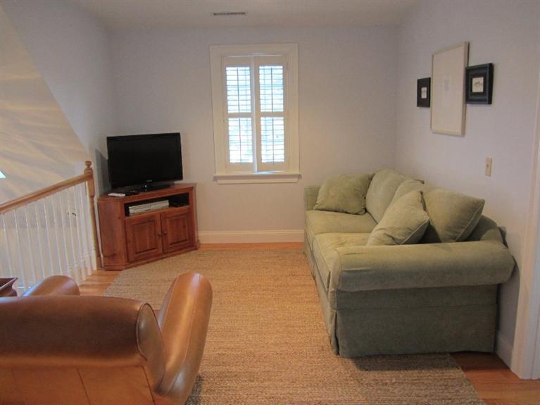 102 Marsh View Road Chatham, MA 02633 - Photo 21 of 23 a living room with furniture and a flat screen tv